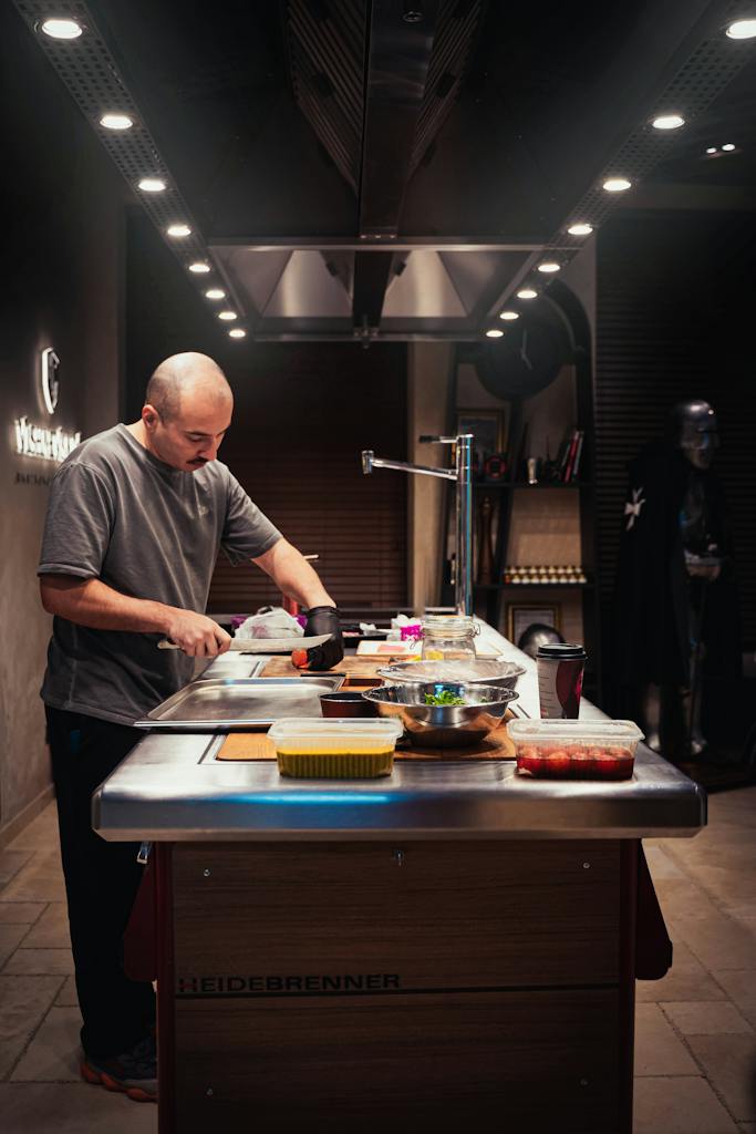 Photo of a Man Cooking in a Luxury Interior